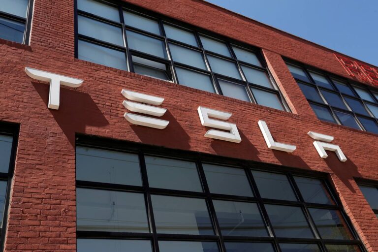 tesla logo main reuters 1627367526932.jpg
